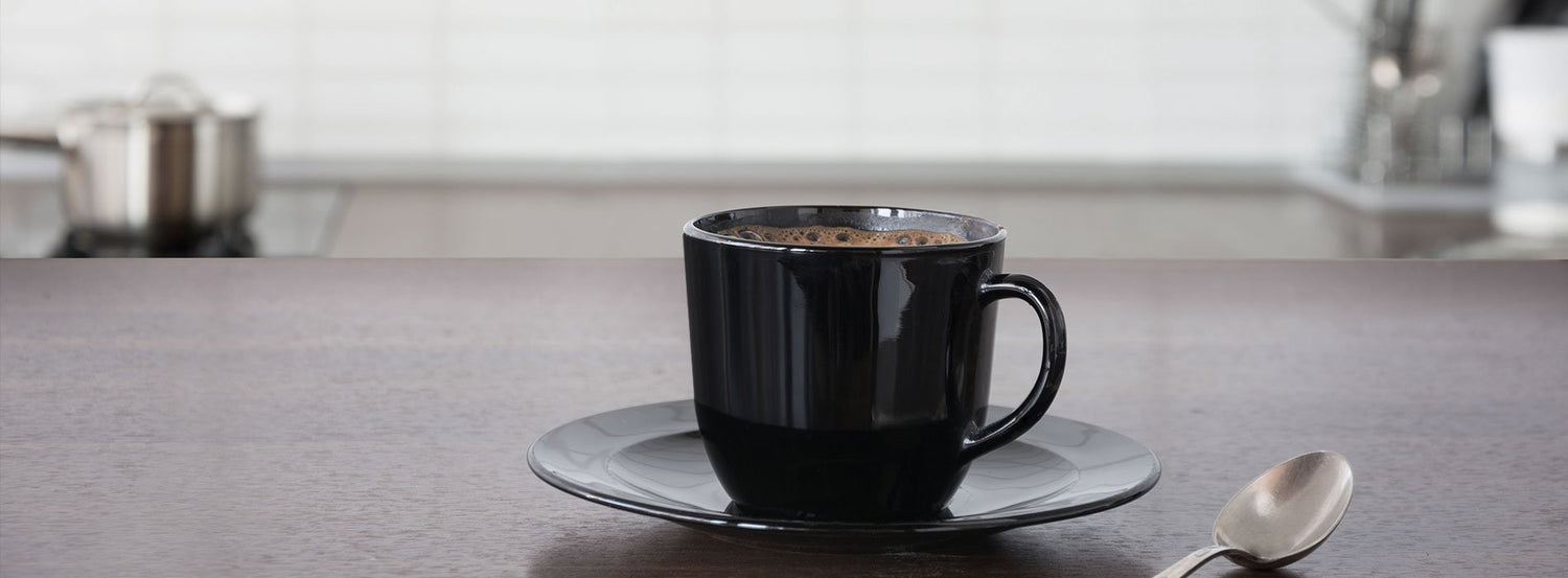 A cup of coffee made by a coffee maker
