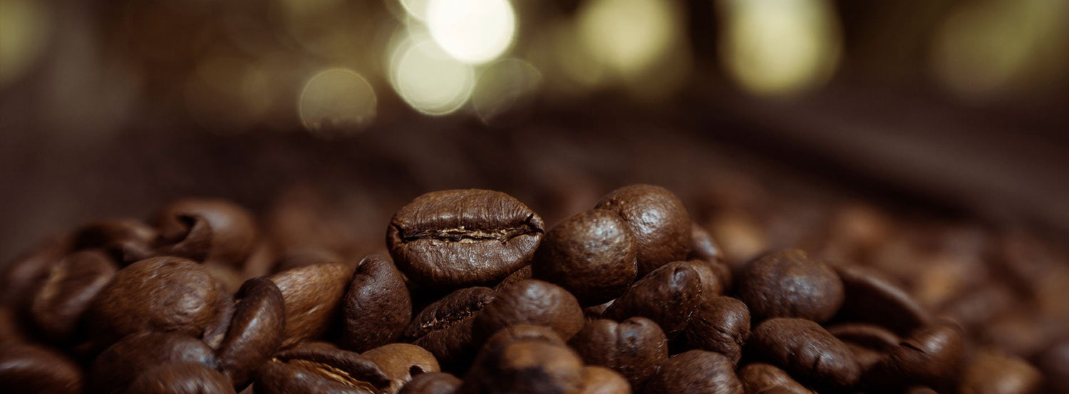 A closeup shot of whole bean coffee from Trinidad Coffee.