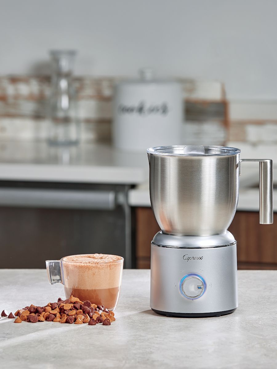 Froth Select with butterscotch chips and a drink on the counter.