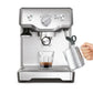 Breville BES810BSS Duo-Temp Pro Espresso Machine with glass cup and milk carafe.