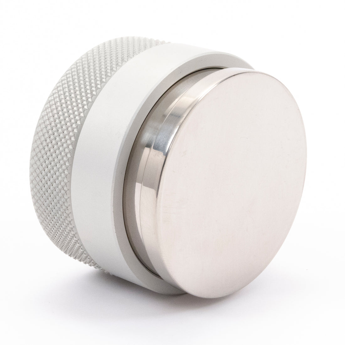 Textured aluminum handle, steel ring, and tamping base.