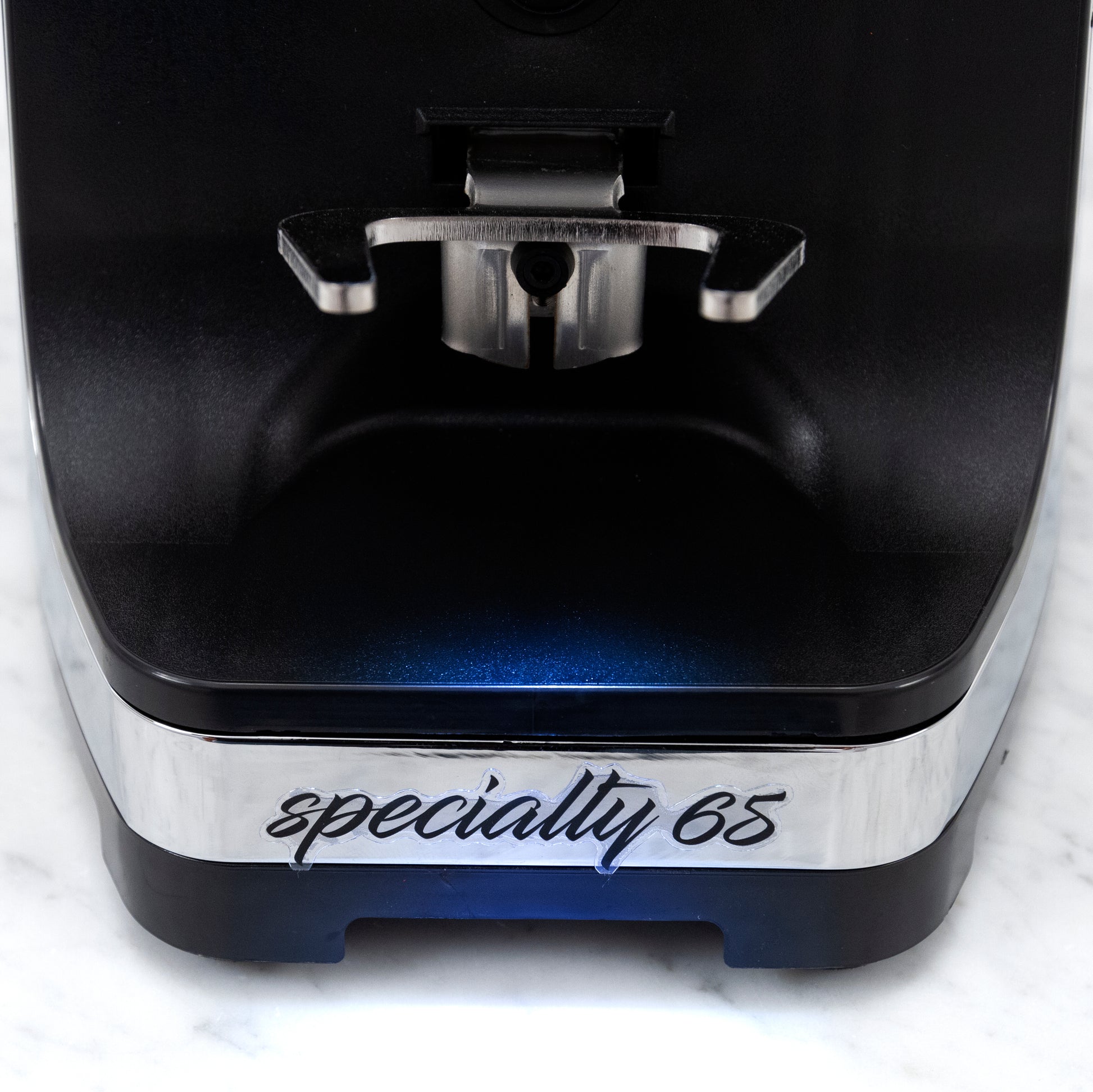 portafilter hooks above the "specialty 65" logo on the base