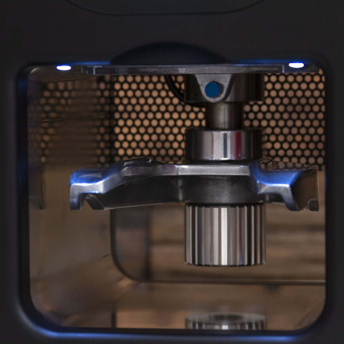 Compak Cube Tamper illuminated tamping bay.