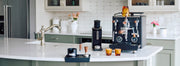 Profitec DRIVE Espresso Machine and other accessories on a kitchen counter.