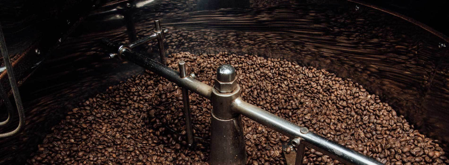 A vat of roasted coffee beans