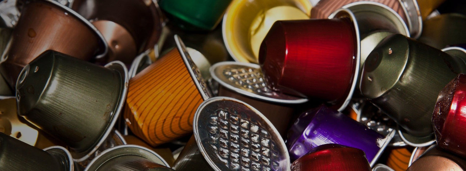 A piled assortment of coffee pods and capsules.
