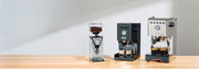Gaggia MDF, Classic UP and Gaggia GT on a wooden counter top in front of a gray wall.