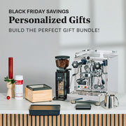 Profitec Pro 500 PID next to a Profitec Twist Grinder and other accessories on a white counter with promotional text for Black Friday savings and personalized gifts.
