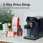 Gaggia Magenta Plus machine next to Hollander chocolate sauce, gaggia service kit, Gaggia arabica coffee and a stack of cups with a Christmas tree in the background. "Promotional text that reads 7-Day Price Drop."