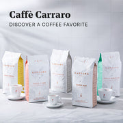 Close-up of Caffe Carraro coffee bags lined up with Carraro espresso cups on a white counter top in front of a white tiled wall. Promotional text overlayed that reads "Caffe Carraro - Discover a coffee favorite".