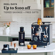 Profitec DRIVE Espresso Machine in black and other accessories on a kitchen counter. Promotional text overlayed that reads "DEAL DAYS: Up to $100 Off Tiered Savings + Free Gifts".