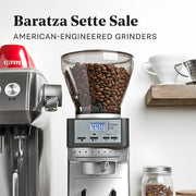Baratza Sette 30 grinder with coffee beans on a white background.