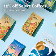 Whole Latte Love Coffee Bags laid out on a blue backdrop. Promotional text overlayed that reads "15% off select coffees all month long".