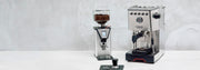 Gaggia Classic GT next to a Gaggia MDF 55 on a white counter in front of a gray wall.