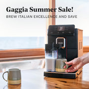Gaggia Magenta Prestige brewing a latte into a green mug on a table in front of a window. Promotional text overlayed that reads "Gaggia Summer Sale! Brew Italian excellence and save".