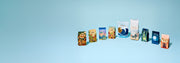 All of Whole Latte Love coffee bags lined up on a blue background.