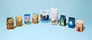 Close-up of all of Whole Latte Love coffee bags lined up on a blue background.