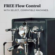 ECM Synchronika II in Anthracite with flow control on a white tiled background. Promotional text overlayed that reads "FREE Flow Control with select, compatible machines."