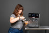 Erika posing with her favorite espresso machine, the Gaggia Accademia