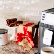 Close-up of a wrapped gift on a counter.