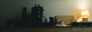 Gaggia Classic UP on a counter with cups and a sign reading 'Today's Brew Beaned Up' in a dimly lit room.