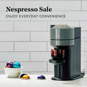Nespresso coffee machine with colorful capsules on a kitchen counter, against a white tiled wall.