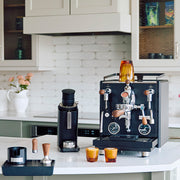 Profitec Drive Espresso machine in Black and coffee-making equipment on a kitchen counter.