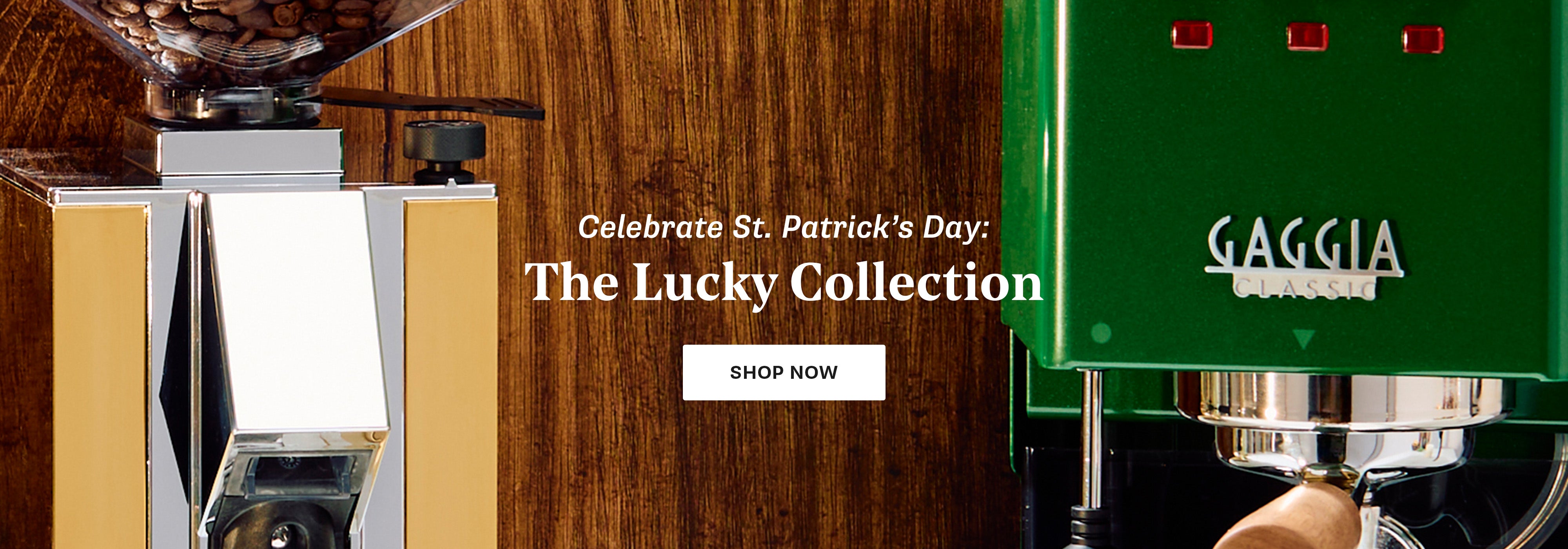 Gaggia Classic E24 in Green next to a Gold Eureka Silenzio 55 with text promoting St. Patrick's Day collection on a wooden background.