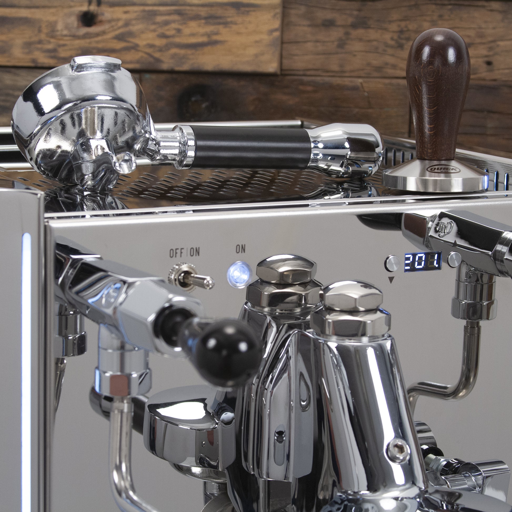 Each Vetrano Design includes a single and double spout portafilter along with a wood handle tamper.