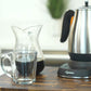Pour over kettle, coffee glass, and glass carafe.